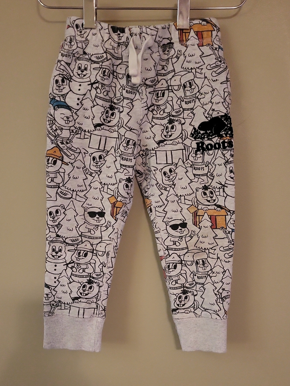 Roots cartoon print joggers with orange & blue accents